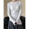 Camiseta negra de cuello redondo y manga larga, de estilo francés irregular, para mujer, diseño de principios de otoño, corte ajustado, top base ceñido a la cintura