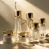 Set de botellas de productos para el cuidado de la piel 120ml 100ml botellas de tónico loción sérum tarro de crema facial de 100g en stock para venta al por mayor