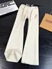 Jeans de algodón puro bordados color blanco roto cleanfit para hombre corte diagonal americano pierna curva pantalones high street pierna recta pantalones ligeramente acampanados