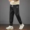 Calça Esportiva Solta de Inverno 2025 Transfronteiriça para Homens e Meninos Outono e Inverno Veludo Roupa de Trabalho Calça Casual