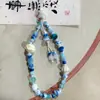 Jingdezhen Cerámica Dulce Estrella de Mar Vieira Moda Cadena para Teléfono Móvil Cuerda Colgante para Bolso de Cámara Nuevo para Mujer Venta al por Mayor