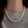 Collar largo de doble capa de perlas de imitación de venta caliente transfronteriza para mujer, temperamento versátil, cadena de cuello multicapa, cadena para clavícula, joyería al por mayor