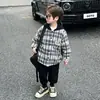 Abrigo de Lana a Cuadros con Capucha para Niños Otoño/Invierno 2026 Ropa de Invierno Nueva y Elegante para Bebés Cortavientos Acolchado de Algodón Top Fresco
