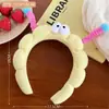 Yu Shuxin com faixa de cabelo fofa divertida faixa de cabelo de pelúcia de olhos grandes faixa de cabelo de caveira alta top lavar rosto pressão faixa de cabelo foto menina