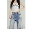 Jeans Vintage Azul Rasgado de Perna Larga 2026 Tendência Versátil Novo Design Caimento Solto Calça Levemente Flare
