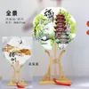 Venta al por mayor de fábrica Yangzhou lugar escénico wenchuang pintura flotante reloj de pared para fichar recuerdo turístico abanico de papel de arroz con borla