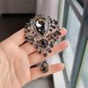 Broche de cristal de estilo retro con incrustaciones de aleación y alfiler de diamantes de imitación, colgante de color, ramillete, ropa transfronteriza entre Europa y Estados Unidos.