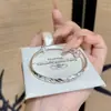 Pulsera Sólida Redonda de Vientre de Lluvia de Meteoros Pulsera Simple de Tubo Redondo de Aleación Plateada Modelo Joven que Reduce la Edad