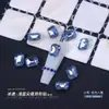 Nail art elegante cristal azul grande jóias de diamante azul claro torto pêssego coração fundo pontiagudo broca cor em forma de unha pilha broca atacado
