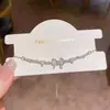 Pulsera de circonita en forma de corazón con lazo, de lujo ligero y versátil para mujer, diseño de nicho con un toque de alta gama, nuevo accesorio de mano popular al por mayor
