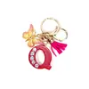 Llavero de Borla de Mariposa con Pedrería Transfronterizo con 26 Opciones de Letras, Colgante de Resina para Bolso, Accesorio de Regalo para Mejores Amigas