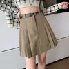 Falda corta de línea A para mujer, nueva falda plisada otoño e invierno 2026, falda pantalón de pana y lana de cintura alta anti-exposición
