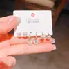 Verano nuevo chapado en oro real exquisitos tres pares de aretes pequeños de alto sentido pequeños frescos dulces aretes de temperamento combinables