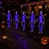 Luces de cadena de Halloween transfronterizas, luces de suelo de calavera, luces decorativas de ambiente para patio exterior y césped alimentadas por energía solar, esqueleto simulado