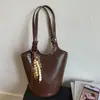 Bolso Cubo de Alta Gama con Patrón de Piedra Transfronterizo para Mujer, Nuevo Verano 2026 Bolso Cruzado Simple Casual para el Trabajo
