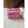 Bolsa de maquillaje a rayas de tres capas, modelo nuevo 2026, gran capacidad, alto valor estético, bolsa portátil de viaje para artículos de tocador y cosméticos