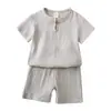 Traje Nuevo de Verano para Niños Color Sólido Algodón y Lino Manga Corta Top y Shorts Conjunto de Dos Piezas Agente Mayorista