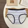 Tanga de algodón puro de talla grande para mujer, entrepierna de algodón completa, entrepierna extendida para 180 Jin, cintura media, sin pellizcos en los glúteos, ropa interior para mujer de tallas grandes.