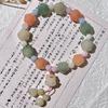 Pulsera de bodhi de flor flotante en polvo natural para hombres y mujeres camelia anillo individual pulsera de mano cuentas cuentas texto placa de juego cuerda venta al por mayor