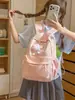 Linda mochila para mujer para viajar, ligera y elegante, adecuada para ir al trabajo, diseño de cachorro de dibujos animados, mochila escolar para estudiantes de secundaria y preparatoria