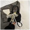 Bolsa Satchel de Nicho com Laço para Mulheres 2025 Nova Moda Primavera e Verão Bolsa Concha com Textura Bolsa Transversal Versátil