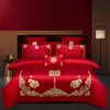 Juego de ropa de cama de lujo estilo chino, hecho de algodón 100% de fibra larga, un juego de cuatro piezas que incluye una sábana y una funda de edredón de algodón puro rojo, perfecto para la alcoba de una recién casada.
