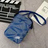 Marca de moda esportiva ao ar livre bolsa de peito feminina à prova d'água bolsa de corrida estudante masculino multi-funcional bolsa de ciclismo bolsa de ombro mensageiro bolsa pequena