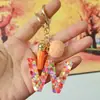 Chaveiros de letra com pompom estilo europeu e americano, chaveiros de letra em formato de coração de resina de cristal para meninas