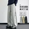 Nuevos pantalones casuales de pierna recta para trabajo de primavera y otoño para hombre, con un diseño moderno estilo americano, corte holgado, talla grande, versátil y un look sofisticado con perneras anchas.