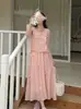 Chal sin mangas con lazo tridimensional de la primavera de 2026 Vestido falso de dos piezas