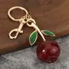 Pingente de bolsa de fruta romã, chaveiro moderno mais vendido, acessório para bolsa, presente criativo para mulheres, decoração de carro