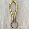 Llavero de cuerda de cuero trenzado simple creativo colgante de muñeca linda accesorios de llave para parejas tendencia regalos pequeños venta al por mayor