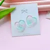 Nuevo fresco botón de amor de cuatro agujeros accesorios diy ropa de niños accesorios de botón de abrigo corazón de melocotón multicolor venta al por mayor