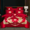 Juego de ropa de cama de lujo estilo chino, hecho de algodón 100% de fibra larga, un juego de cuatro piezas que incluye una sábana y una funda de edredón de algodón puro rojo, perfecto para la alcoba de una recién casada.