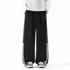 Calça de moletom listrada estilo americano, nova coleção de outono, corte solto, tecido fluido, design color-block, versátil para esportes e uso casual