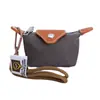 Mini Bolsa de Nylon para Empanadas 2026 Nuevo Modelo Bolsa para Audífonos Bloques de Color Compacta para Monedas y Llaves Bolso Cuadrado Pequeño de Moda