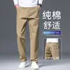 Calça casual masculina de algodão puro de alta qualidade, coleção outono e inverno 2026, calça masculina versátil de corte reto e folgado, adequada para homens de meia-idade, negócios e trabalho.