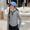 Conjunto de Moletom Outono para Meninas 2026 Novo Modelo para Meninas do Ensino Fundamental, Moletom Listrado e Calça de Foice Conjunto de Duas Peças Infantil