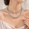 Collar elegante de doble capa con cadena de clavícula apilada con perlas de imitación a juego retro de joyería transfronteriza europea y americana
