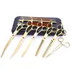 Tijeras de belleza para mascotas de 7.0 pulgadas color negro galvanizado 5 dientes de corte recto tijeras de corte curvo tijeras de hueso de pescado peine de fila en stock