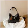 Shuai Mijia 2026 Nova Textura de Outono Bolsa Simples Feminina Fashionable Retrô Bolsa de Axila Casual Bolsa de Ombro Único Transversal