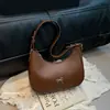 Nova Textura da Moda Francesa 2026 Casual Decoração de Laço Estilo Retrô Feminino Bolsa de Ombro Único Transversal sob o Braço Feminina