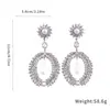 Pendientes de plata de aguja transfronterizos europeos y americanos con diamantes y perlas en diseño de lágrima, estilo exagerado y único, lujo ligero y sensación de alta gama