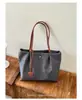 Bolso tote nuevo de nailon 2026, bolso de hombro de gran capacidad para el trabajo, bolso de mano retro y versátil, bolso simple estilo dumpling