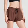 Shorts deportivos de secado rápido para mujer, pantalones de yoga transpirables con cordón anti-exposición, pantalones de fitness de tres cuartos de estilo falso dos piezas, estilo delgado de verano