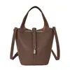 Bolso de Mano Pequeño Texturizado Transfronterizo para Mujer 2026 Nuevo Vintage Versátil Elegante Bolso Cubo para Viaje Diario Bolso de Hombro Único Bolso Cruzado
