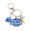 Llaveros personalizados más vendidos transfronterizos, dijes para mochilas, colgantes de aleación para la temporada de graduación, accesorios con temática de campus para las mochilas de los estudiantes