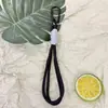 Llavero con tema de dopamina con cordón trenzado, diseño colorido y minimalista, adecuado para teléfonos y llaves de coche, un accesorio elegante con un toque de lujo