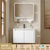 Tocador de baño engrosado y ahorrador de espacio con diseño en color crema, que cuenta con un lavabo redondeado, lavabo cerámico integrado y un lavabo de una sola pieza.