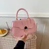 Bolso casual de color sólido 2026 nuevo retro de gran capacidad con cierre de hebilla de metal para ir al trabajo, cruzado y debajo del brazo para mujer